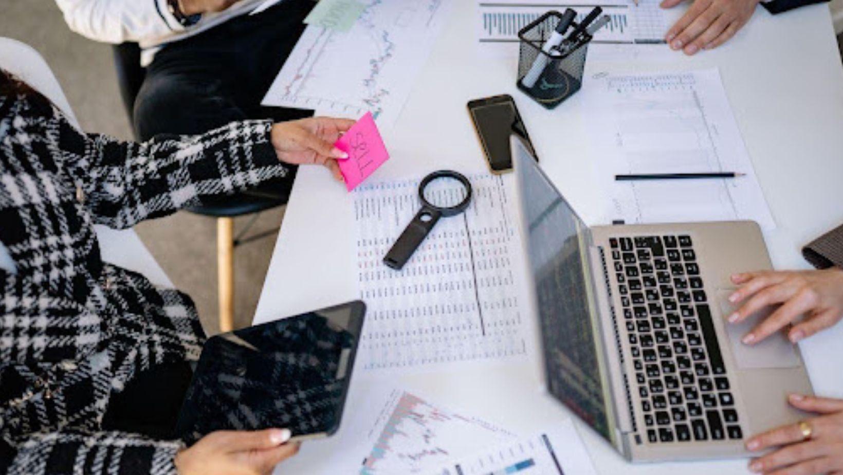 business professionals collaborating on financial data analysis